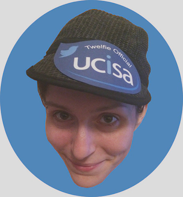 Fiona MacNeill wearing a hat with a badge on it reading UCISA Twelfie Official