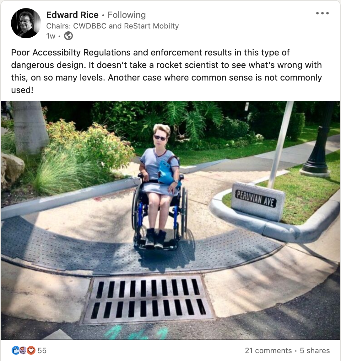 Screenshot of a post on Linkedin, attached image shows a person who is a wheelchair user about to cross a road but a drain is positioned under the lip of the curb, the drain has wider gaps than wheels on the wheelchair, so it is possible the chair wheels will get stuck.