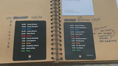 Two pages in a sketchbook showing the back of a conference name badge, displaying the schedule. One is for 2020 and one is for 2022.
